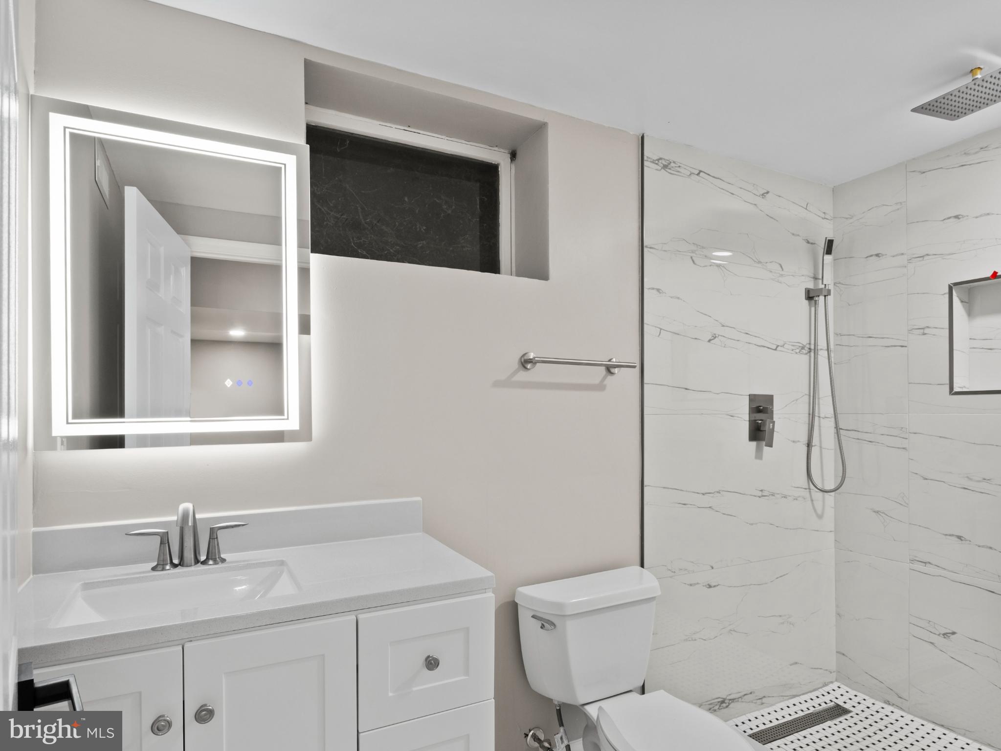 3317 Grayvine Lane Bowie, MD 20721 - Photo 27 of 36 a bathroom with a sink toilet vanity and shower