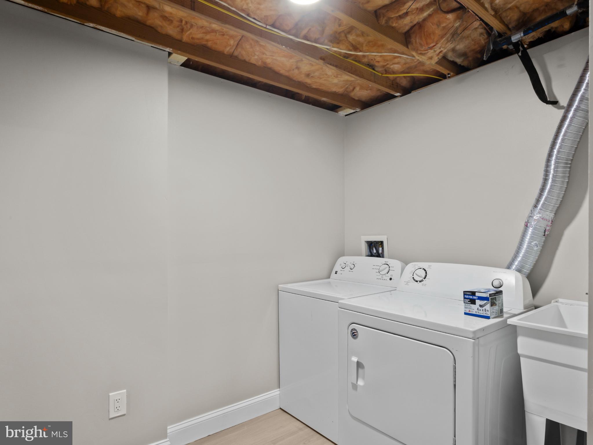 3317 Grayvine Lane Bowie, MD 20721 - Photo 30 of 36 a utility room with dryer and washer