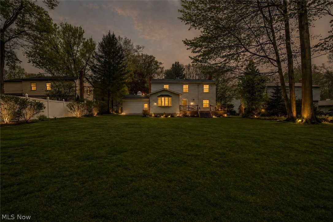 8242 Starburst Road Mentor, OH 44060 - Photo 20 of 37 Expansive rear yard featuring a manicured lawn, established trees, and perimeter landscaping