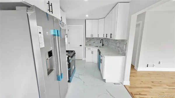 a bathroom with a sink and shower