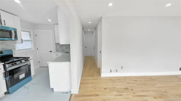 a view of a kitchen with a sink