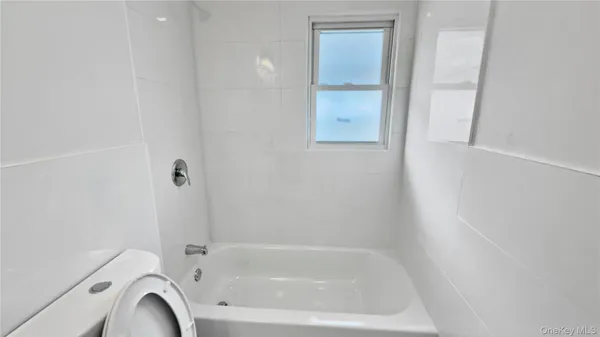 a close view of a bathtub in bathroom