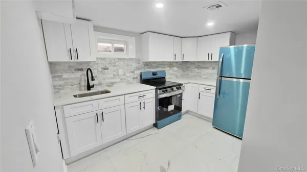 a view of bedroom with a bed and a window