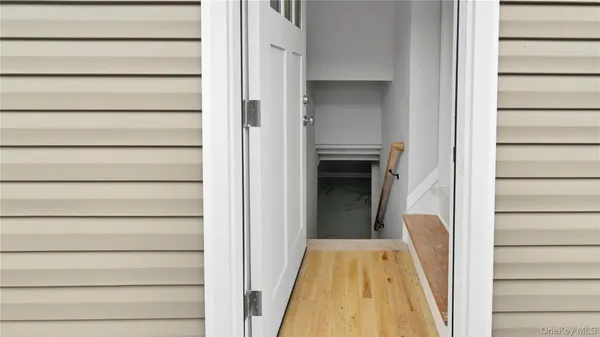 a view of an empty room with stairs and ventilation