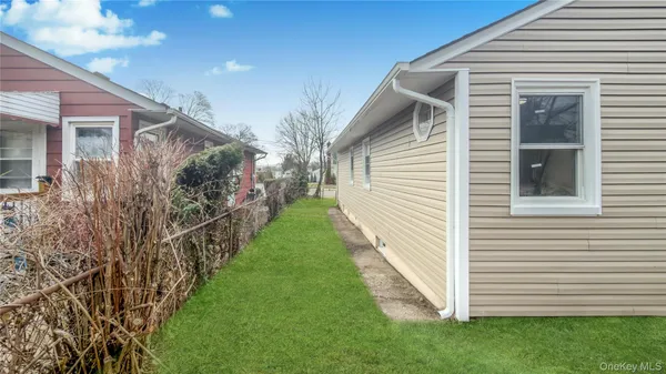 a yellow house with a outdoor space