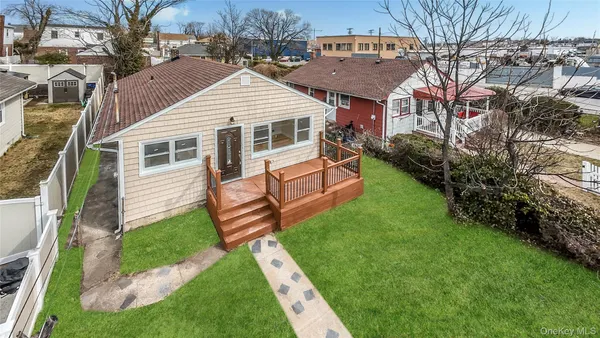 a aerial view of a house with a yard
