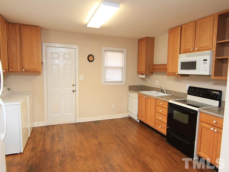 1027 Carpenter Fletcher Road Durham, NC 27713 - Photo 5 of 12 Kitchen has all new cabinets and appliances installed within the past 6 years