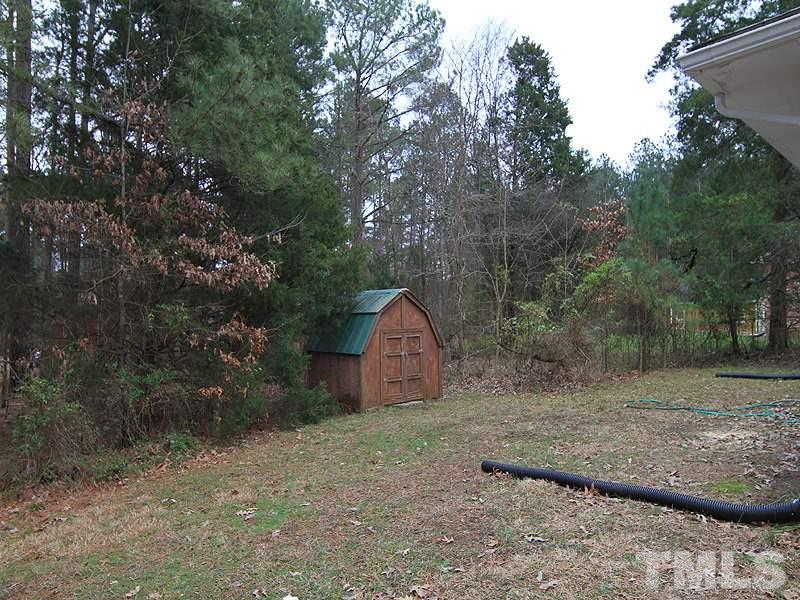 1027 Carpenter Fletcher Road Durham, NC 27713 - Photo 10 of 12 Private, back yard with storage shed