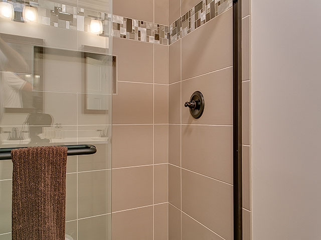 3918 Hope Valley Road Durham, NC 27707 - Photo 16 of 25 This bath has 12x24 tiles and a pebbled floor to give foot massage as you shower. Master Bath