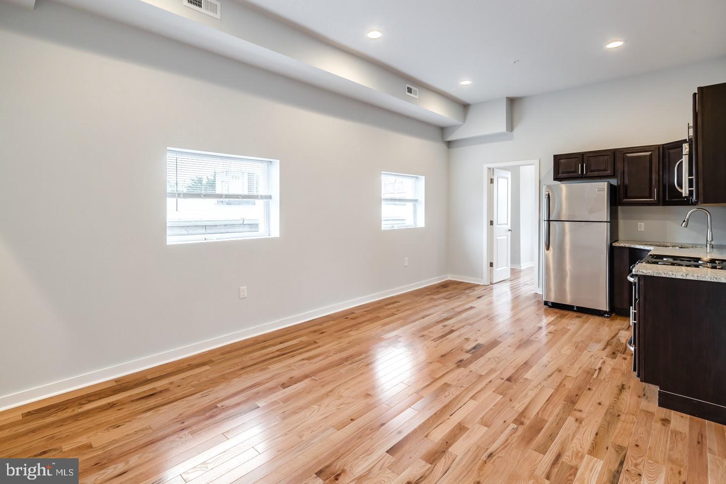 2221 South Broad Street, Unit 2R Philadelphia, PA 19148 - Photo 2 of 7 a view of kitchen with wooden floor electronic appliances and window