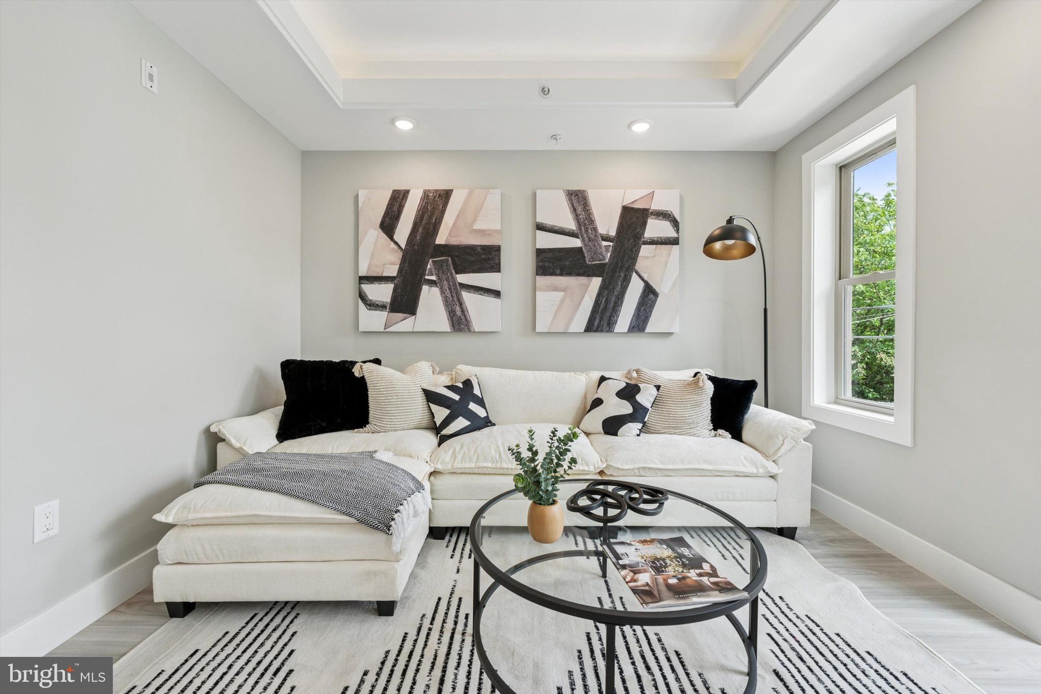 2401 North 2nd Street, Unit D2 Philadelphia, PA 19133 - Photo 14 of 25 a living room with furniture a rug and a window