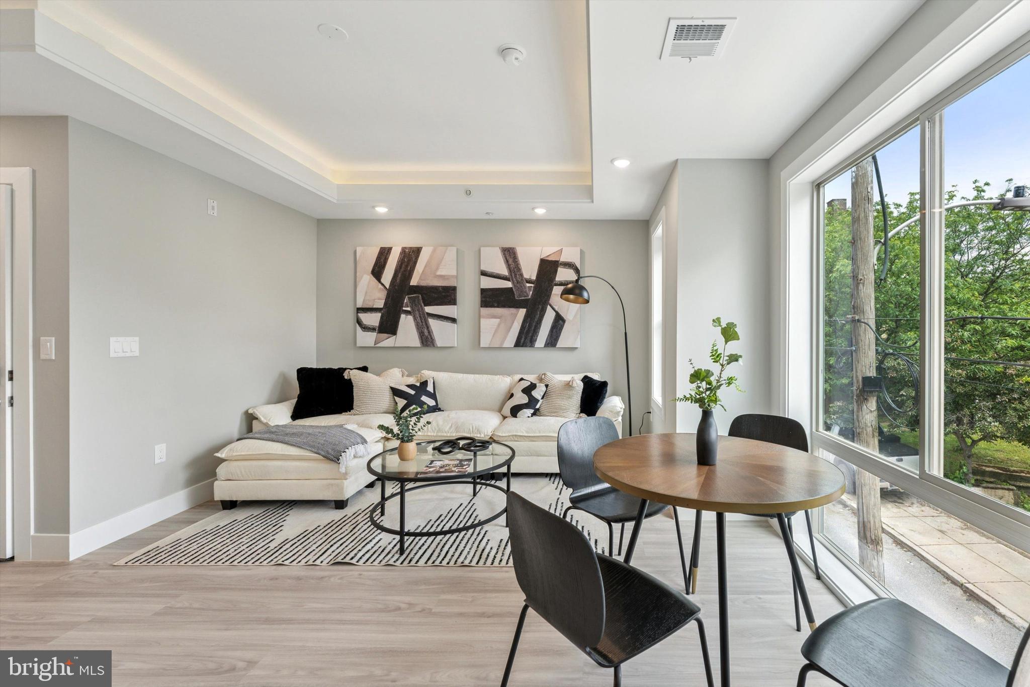 2401 North 2nd Street, Unit D2 Philadelphia, PA 19133 - Photo 16 of 25 a living room with furniture and a large window