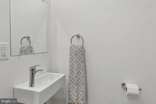 a bathroom with a sink and mirror