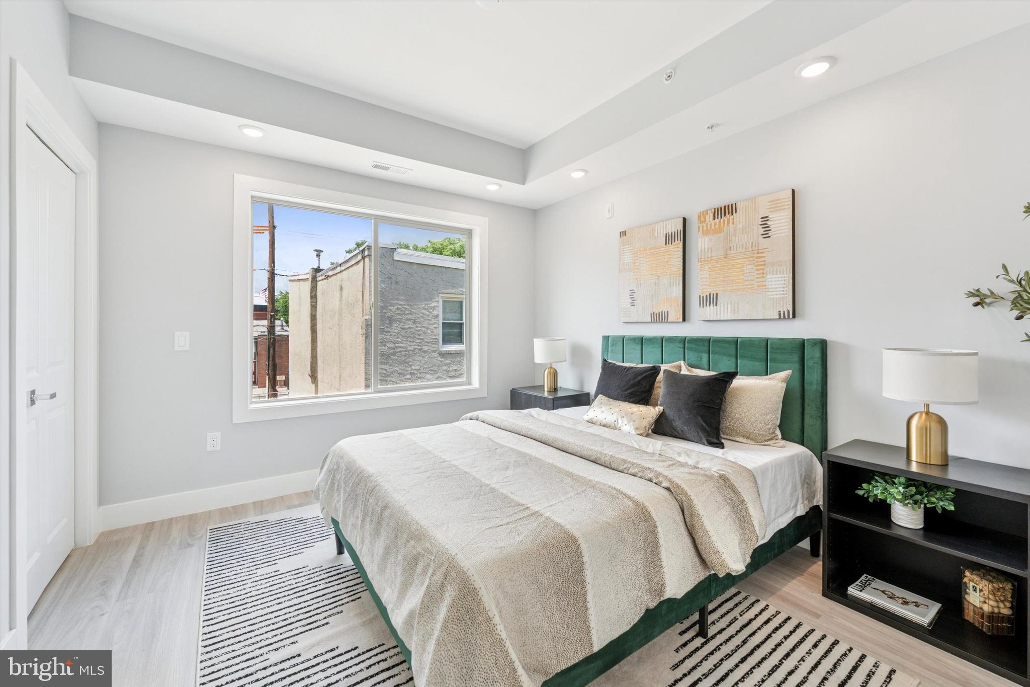 2401 North 2nd Street, Unit D2 Philadelphia, PA 19133 - Photo 24 of 25 a bedroom with bed and a window