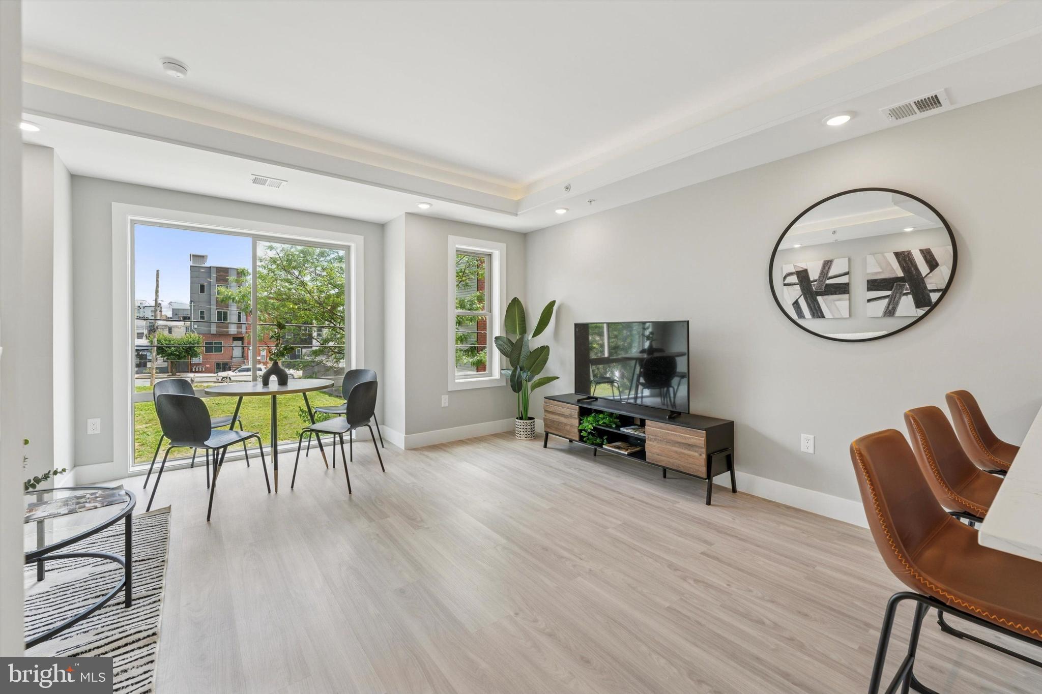 2401 North 2nd Street, Unit D2 Philadelphia, PA 19133 - Photo 9 of 25 a view of a dining room with furniture window and wooden floor