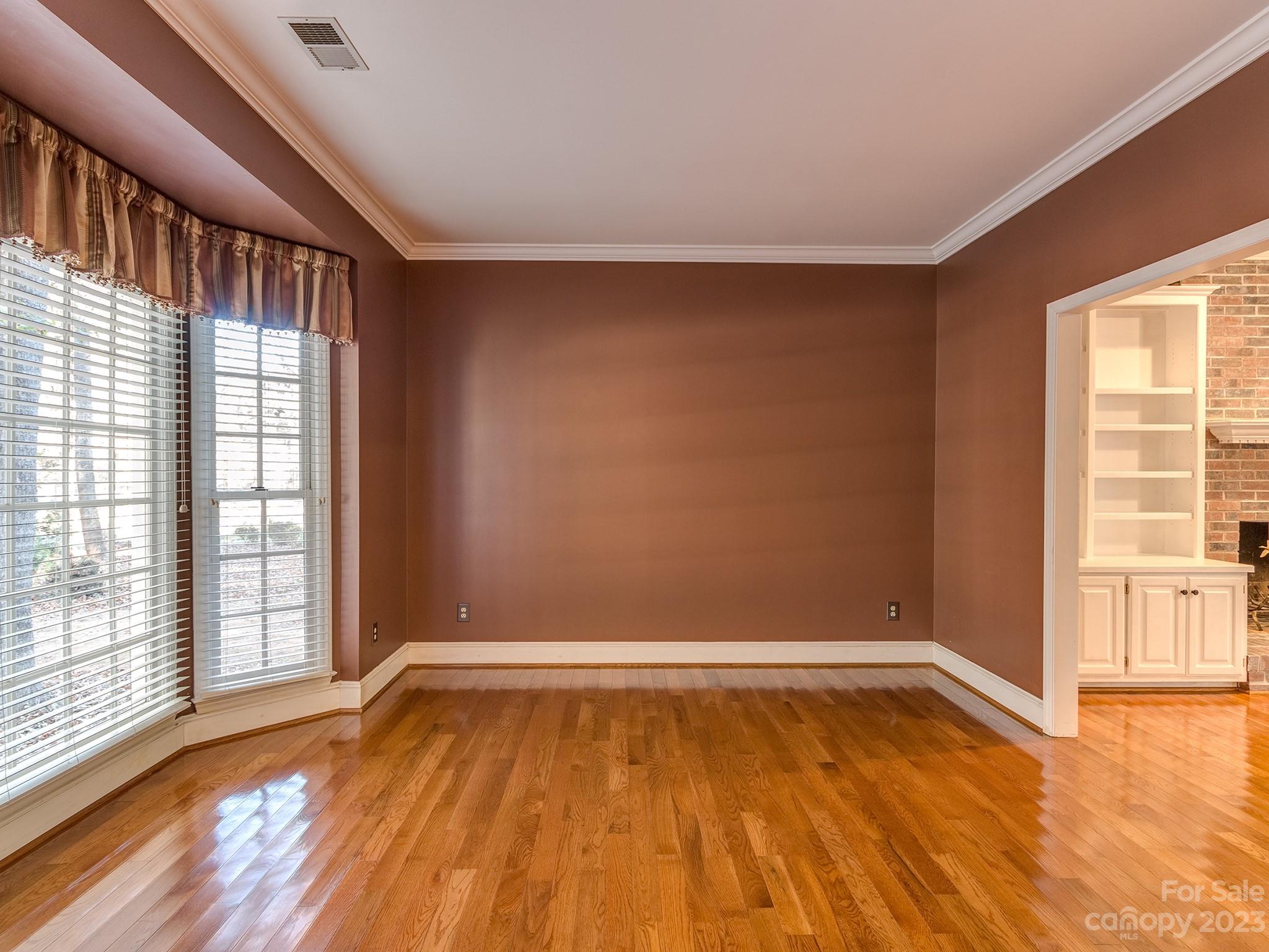 3301 Carnegie Lane Mint Hill, NC 28105 - Photo 12 of 34 wooden floor in an empty room with a window