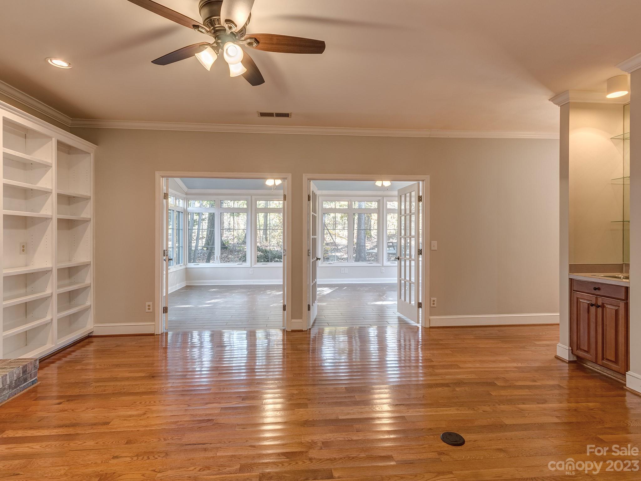 3301 Carnegie Lane Mint Hill, NC 28105 - Photo 14 of 34 a view of empty room with wooden floor and fan