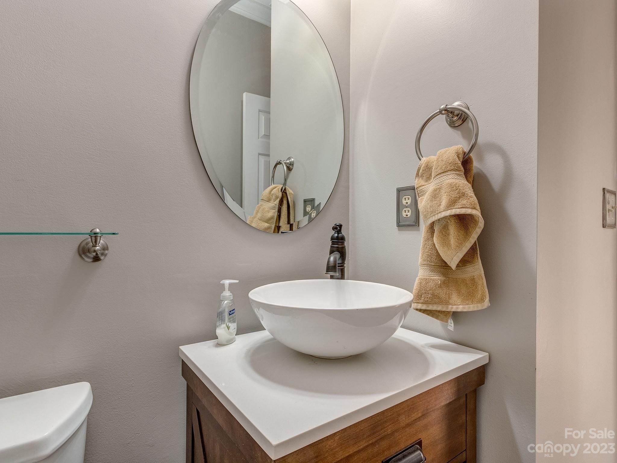 3301 Carnegie Lane Mint Hill, NC 28105 - Photo 15 of 34 a bathroom with a sink mirror and toilet