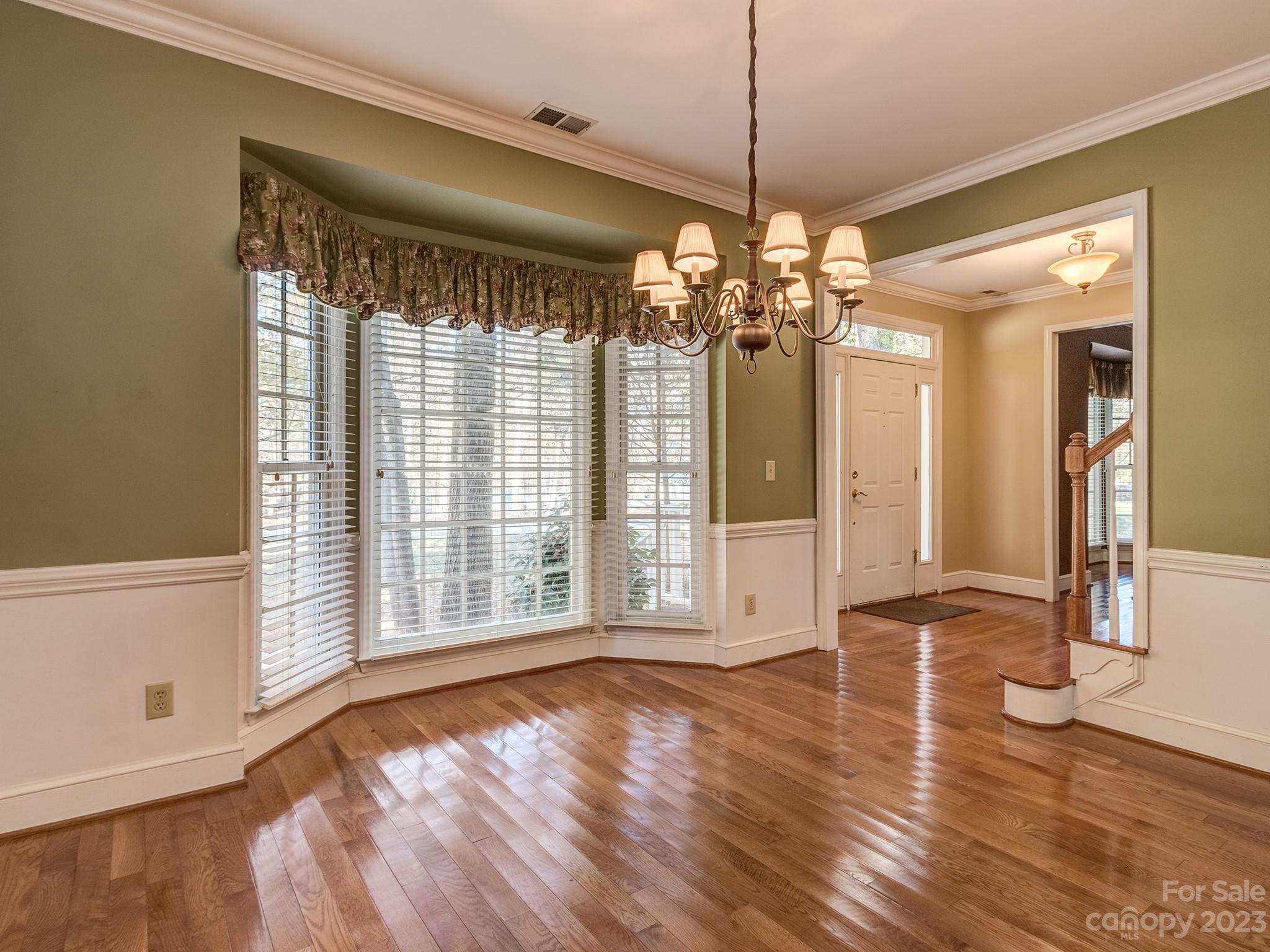 3301 Carnegie Lane Mint Hill, NC 28105 - Photo 16 of 34 a view of an empty room with wooden floor and a window