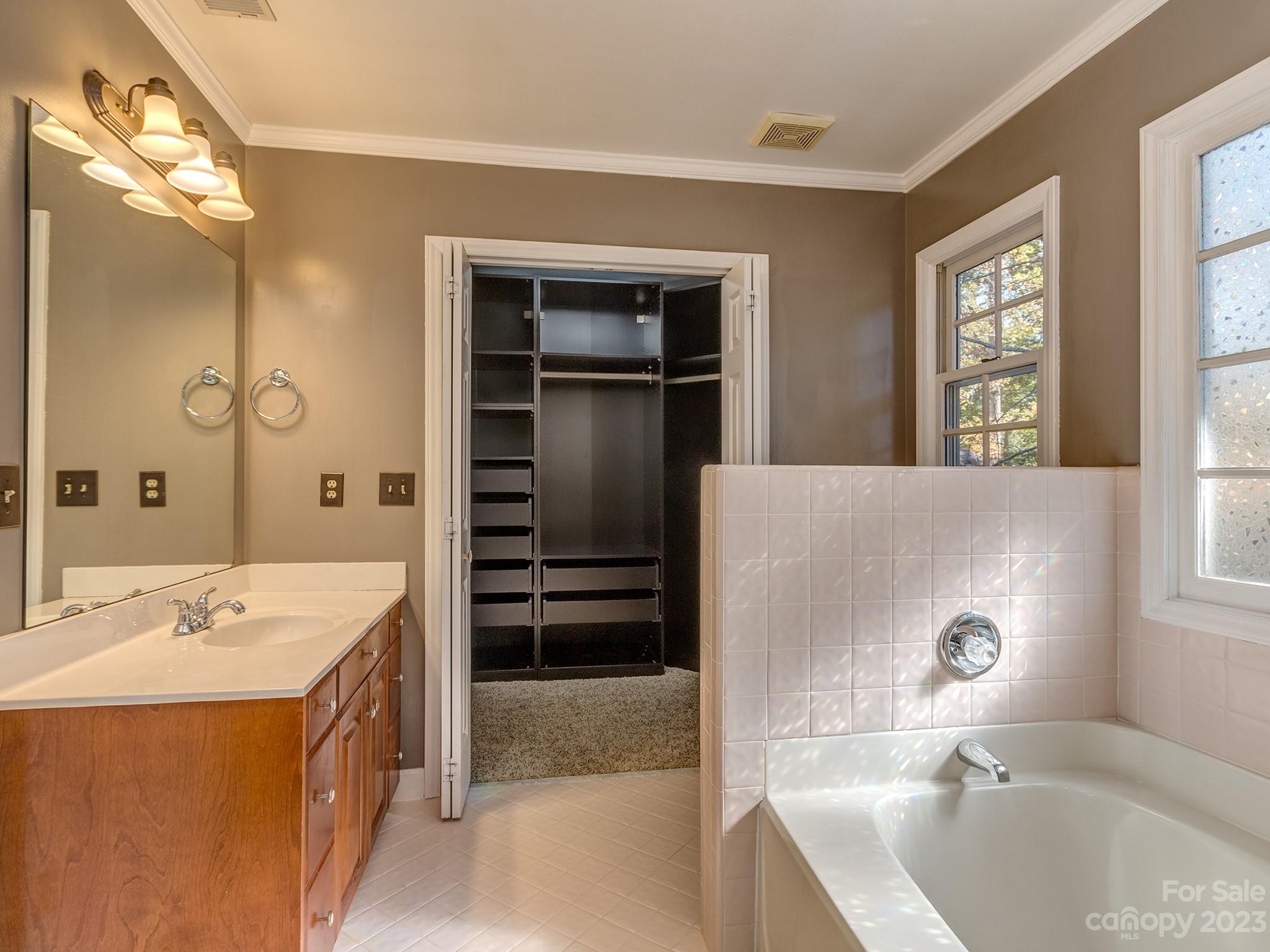 3301 Carnegie Lane Mint Hill, NC 28105 - Photo 22 of 34 a spacious bathroom with a tub sink and mirror