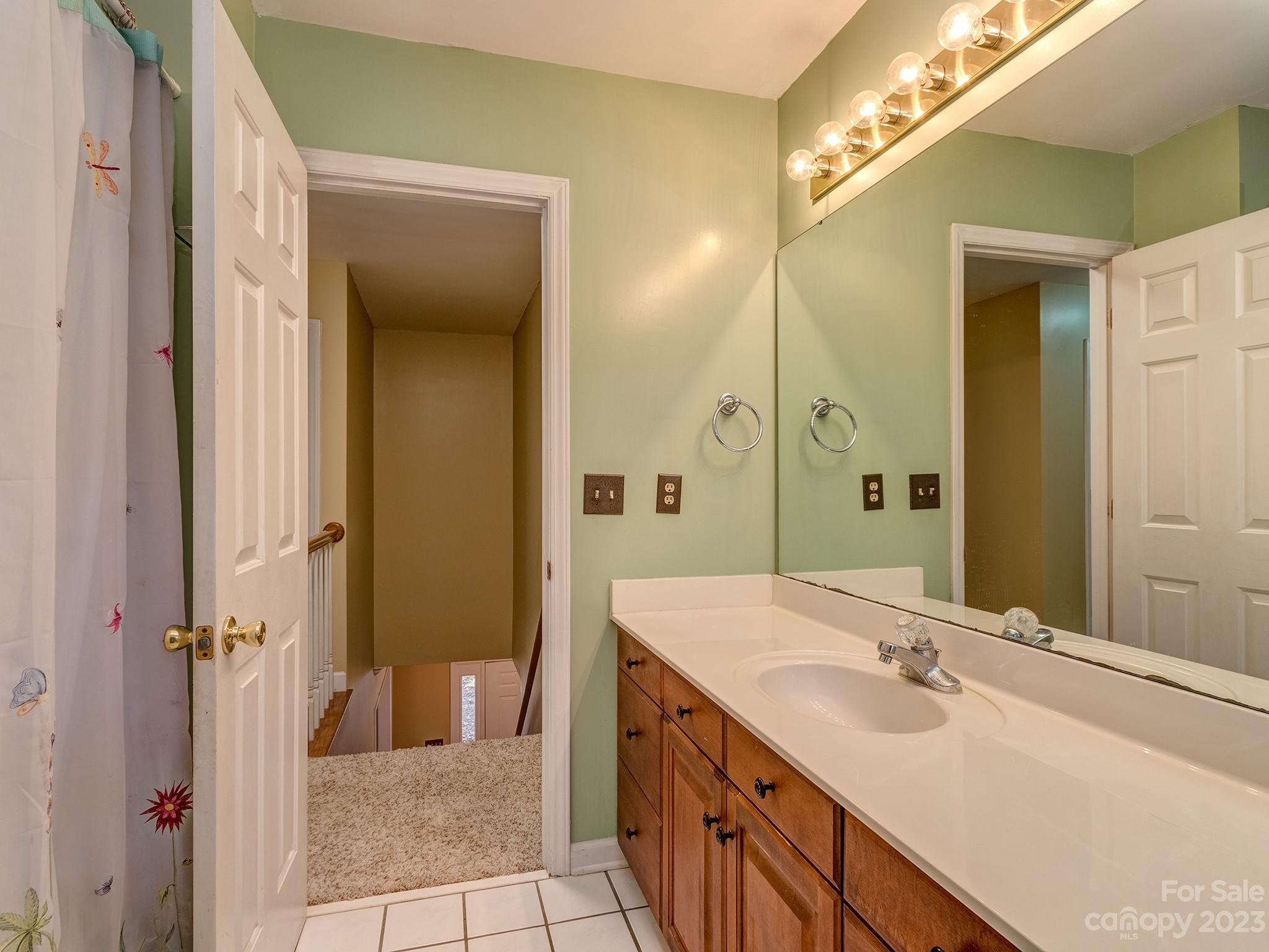 3301 Carnegie Lane Mint Hill, NC 28105 - Photo 26 of 34 a bathroom with a double vanity sink mirror and shower