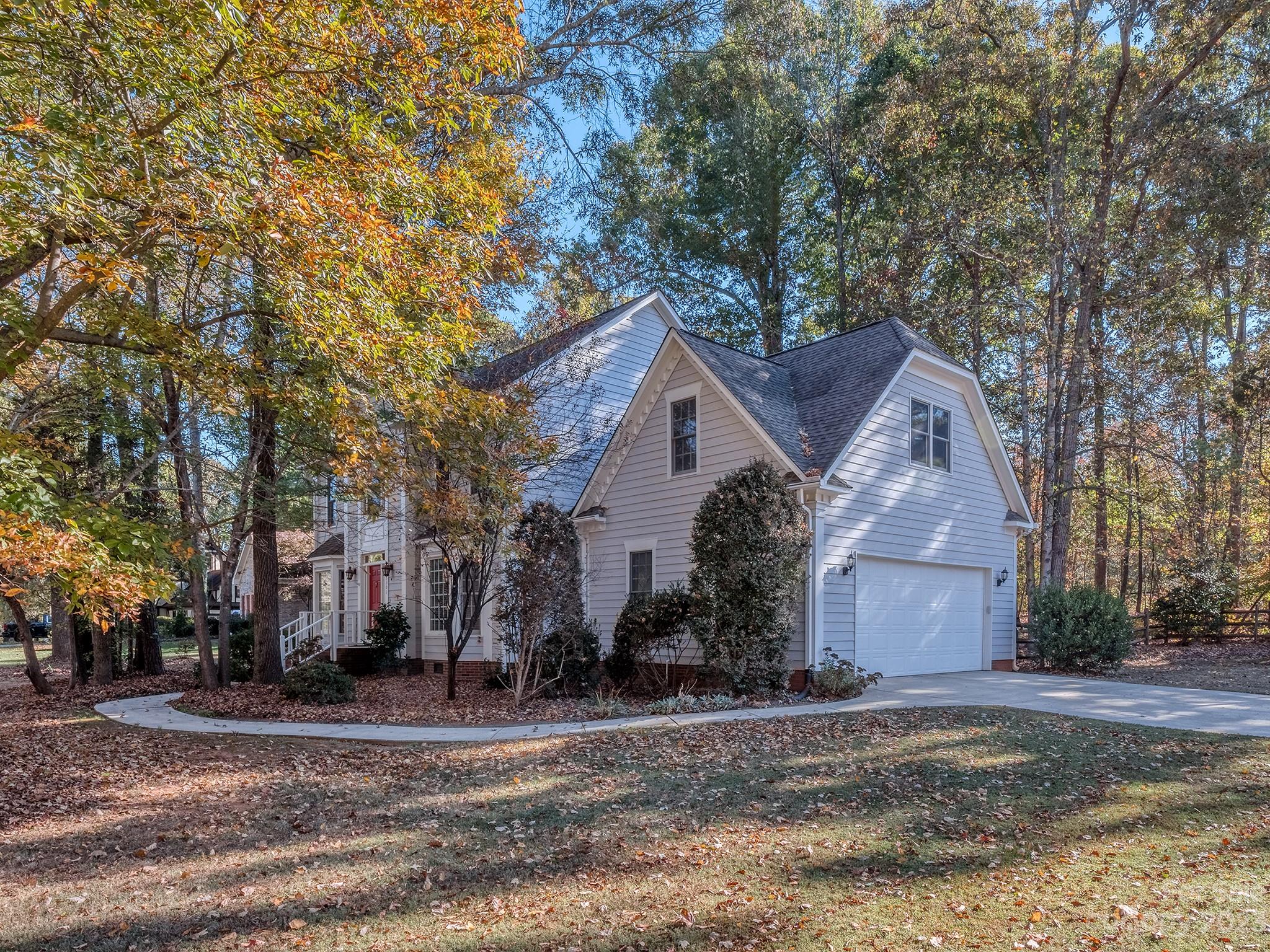 3301 Carnegie Lane Mint Hill, NC 28105 - Photo 9 of 34 a view of a house with a yard and large trees