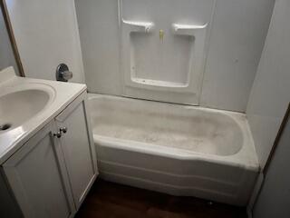 2413 46th Street Lubbock, TX 79412 - Photo 12 of 18 a bathroom with a bathtub and a sink