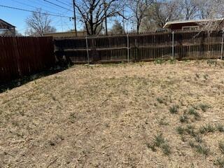 2413 46th Street Lubbock, TX 79412 - Photo 15 of 18 a backyard of a house with lots of green space