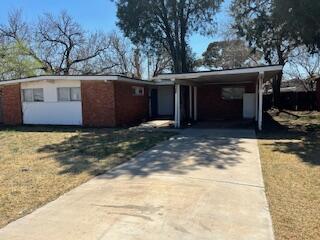 2413 46th Street Lubbock, TX 79412 - Photo 18 of 18 a view of a house with a large tree in front of it
