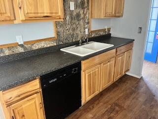 2413 46th Street Lubbock, TX 79412 - Photo 2 of 18 a kitchen with granite countertop a sink and a stove