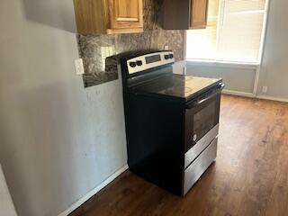 2413 46th Street Lubbock, TX 79412 - Photo 3 of 18 a kitchen with granite countertop cabinets and window