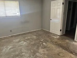 a bathroom with a toilet and shower