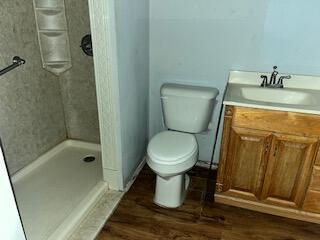 2413 46th Street Lubbock, TX 79412 - Photo 8 of 18 a bathroom with a toilet and shower