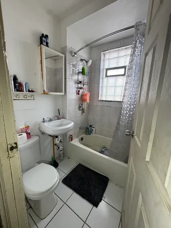 a bathroom with a toilet a sink and a bathtub