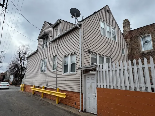 a view of a house with a street