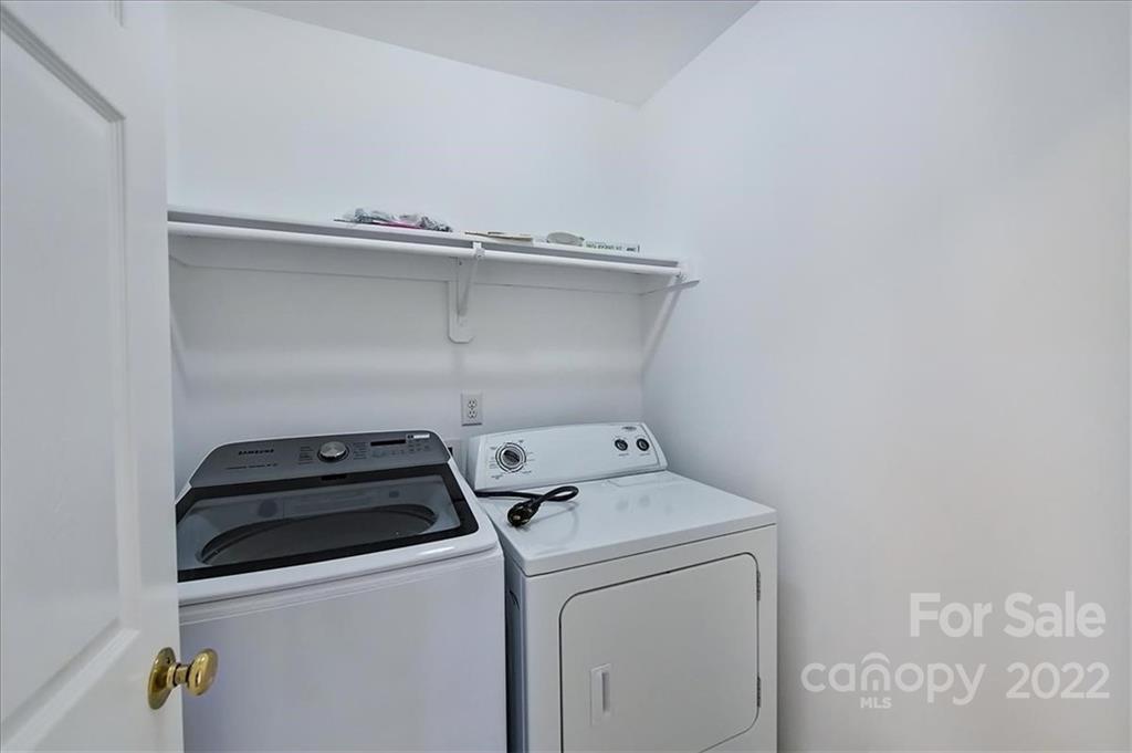 10409 Friarsgate Road Huntersville, NC 28078 - Photo 23 of 30 a utility room with dryer and washer