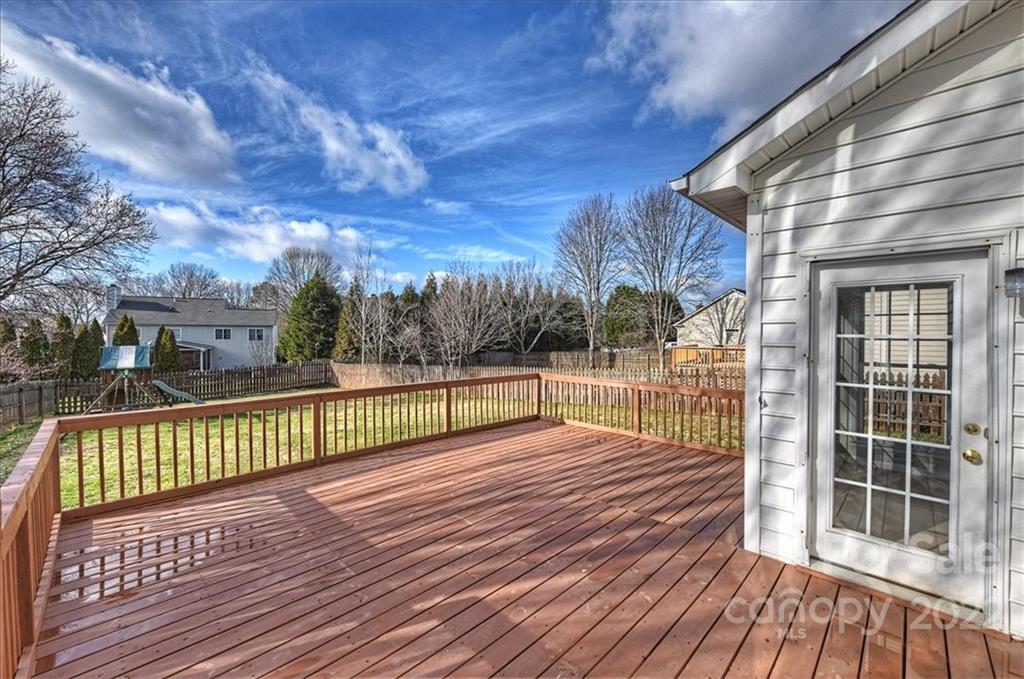 10409 Friarsgate Road Huntersville, NC 28078 - Photo 28 of 30 a view of a balcony with wooden floor