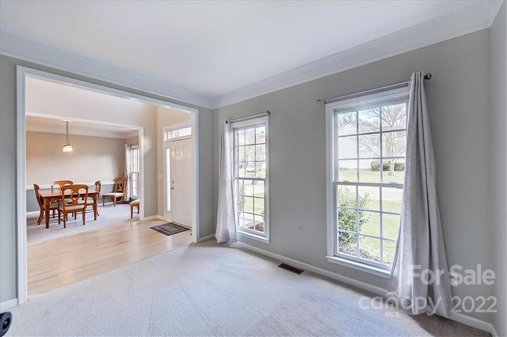 10409 Friarsgate Road Huntersville, NC 28078 - Photo 4 of 30 wooden floor and windows in a room
