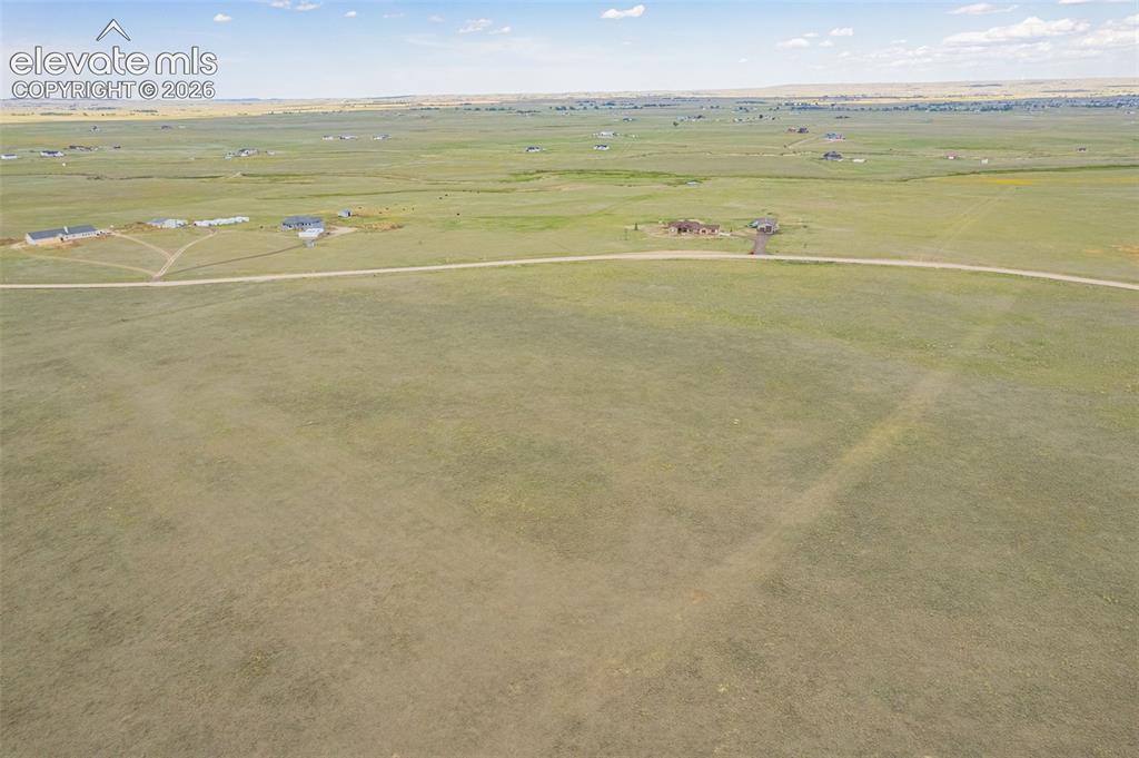 6870 Cowboy Rnch View Peyton, CO 80831 - Photo 5 of 16 a view of an ocean and beach