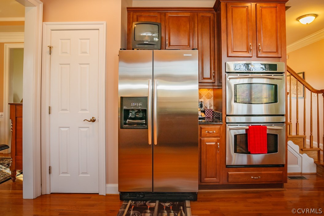 14113 Rigney Drive Midlothian, VA 23113 - Photo 9 of 24 a kitchen with stainless steel appliances granite countertop a refrigerator and a stove