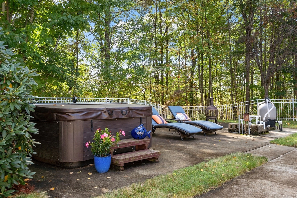 18 Bramley Hill Road Windham, NH 03087 - Photo 13 of 42 a view of a patio with couches and a fire pit