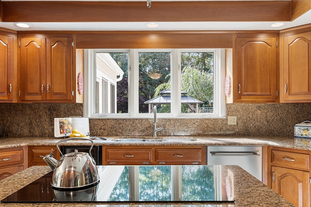 18 Bramley Hill Road Windham, NH 03087 - Photo 22 of 42 a kitchen with a sink and a large window
