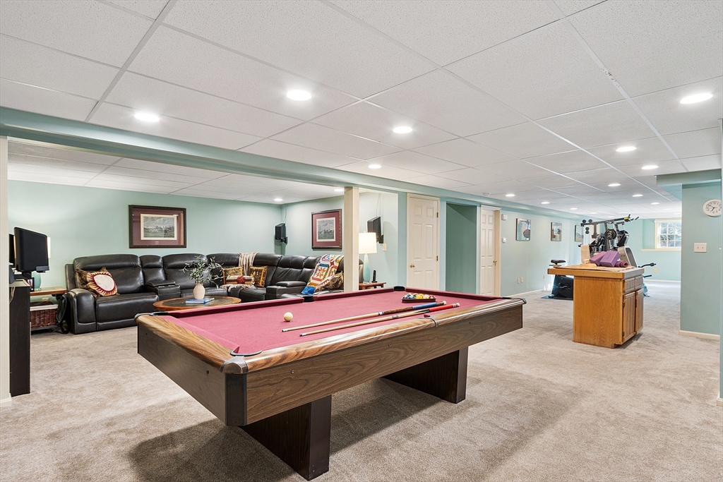 18 Bramley Hill Road Windham, NH 03087 - Photo 41 of 42 a room with pool table and a table