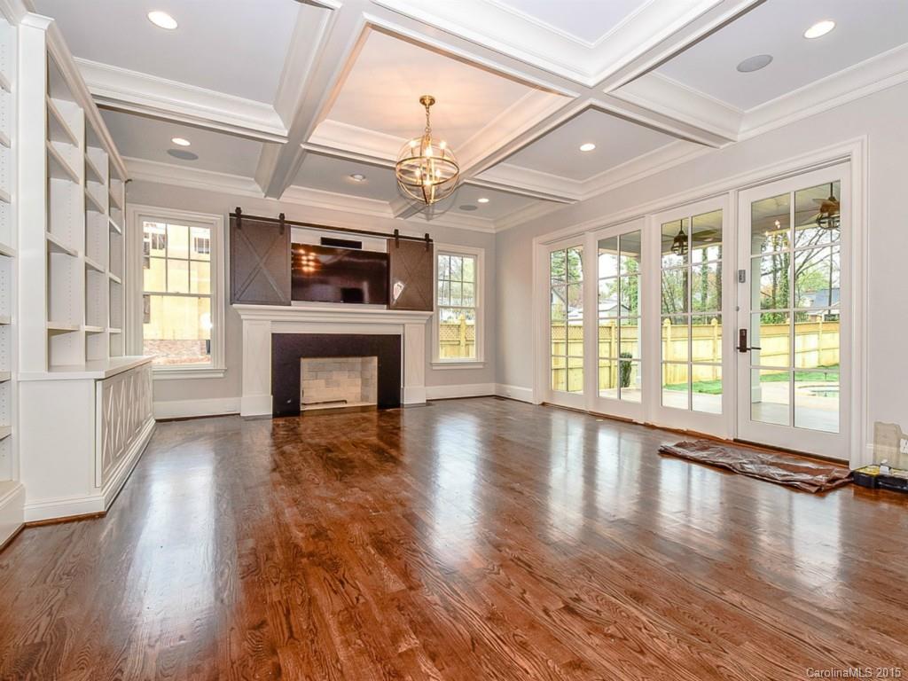 526 Ashworth Road Charlotte, NC 28211 - Photo 4 of 15 a view of an empty room with wooden floor and a fireplace