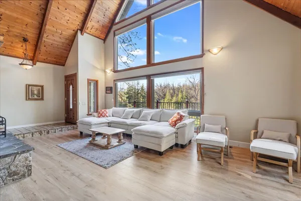 a living room with furniture a fireplace and a counter top space