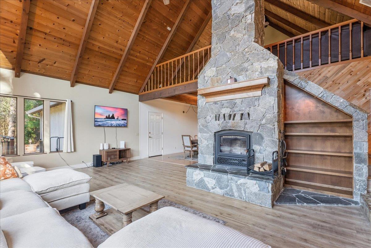 5621 Saw Mill Road Placerville, CA 95667 - Photo 15 of 75 a living room with furniture a fireplace and a counter top space