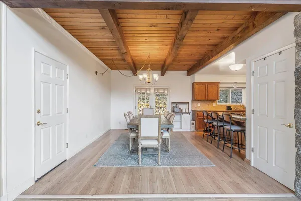 a kitchen with granite countertop cabinets stainless steel appliances and wooden floor