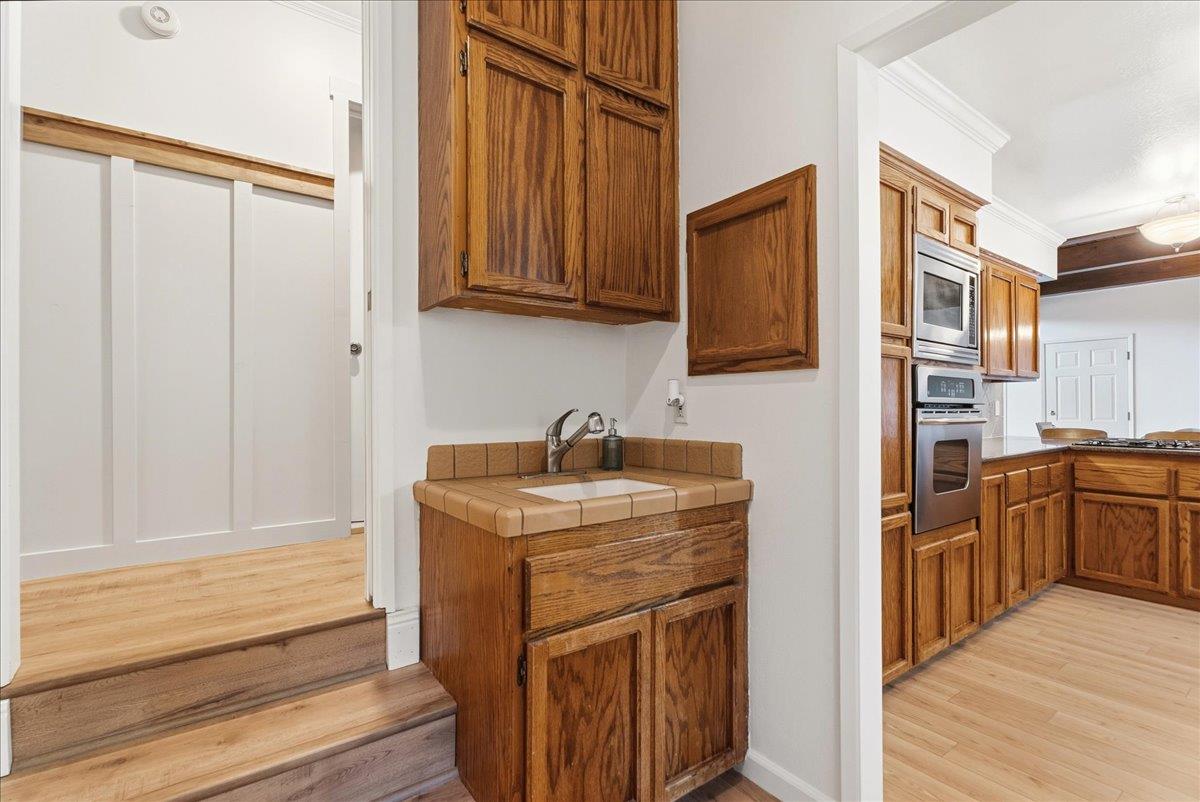 5621 Saw Mill Road Placerville, CA 95667 - Photo 24 of 75 a kitchen with stainless steel appliances granite countertop a refrigerator and a sink