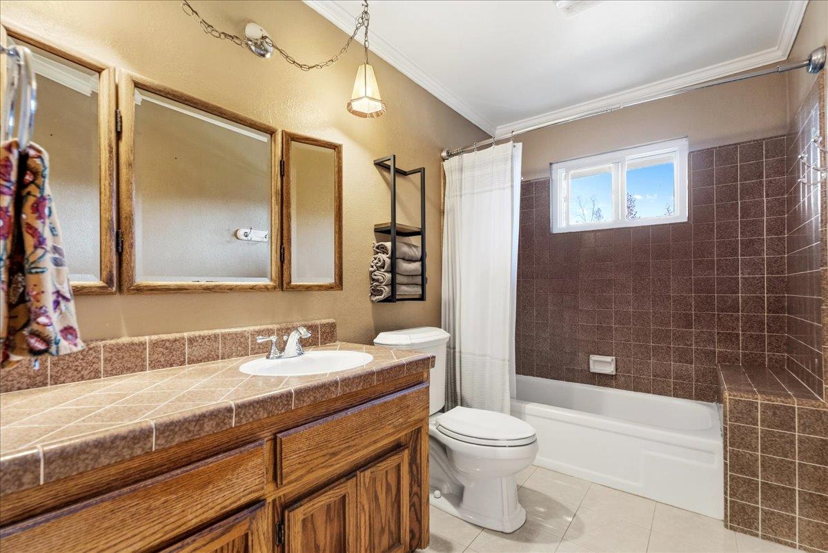 5621 Saw Mill Road Placerville, CA 95667 - Photo 26 of 75 a bathroom with a double vanity sink toilet mirror and shower