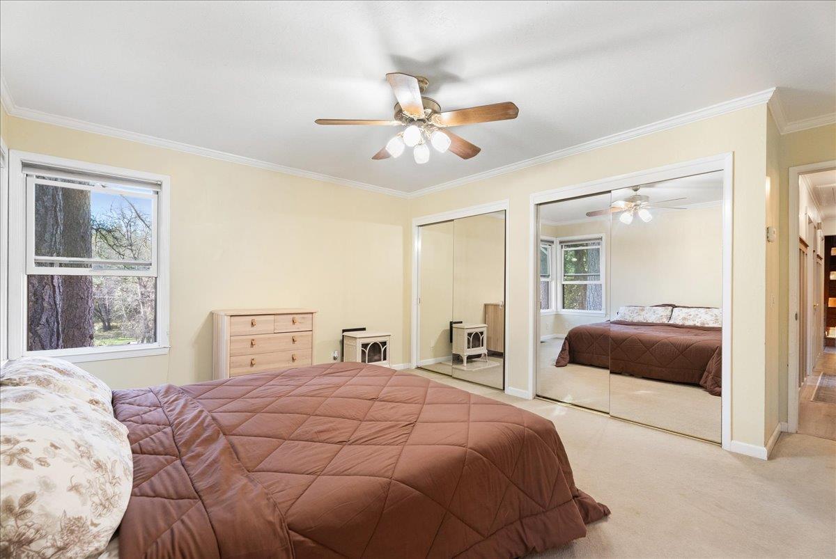 5621 Saw Mill Road Placerville, CA 95667 - Photo 30 of 75 a bedroom with a large bed and a window